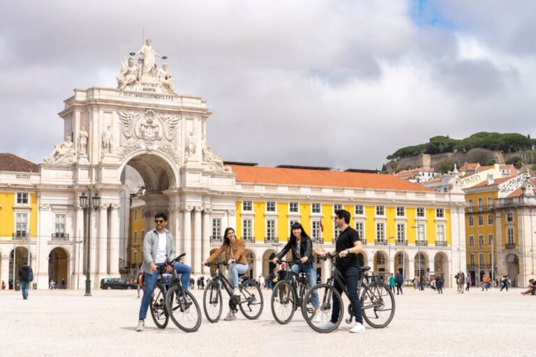 Lisbon: Guided Bike Tour, Helicopter Flight, and Boat Trip