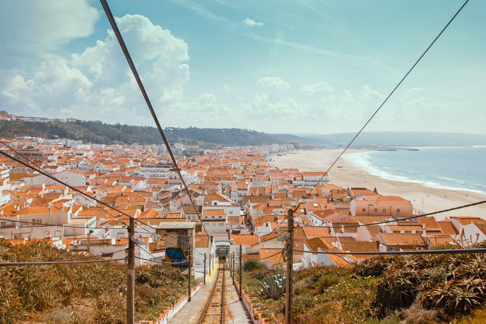 From Porto: Private Transfer to Lisbon With Stop at Nazaré - Duration and Languages