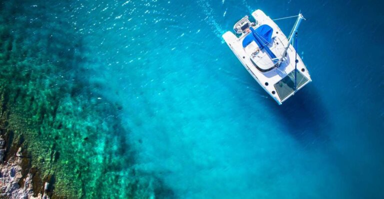 From Ornos: Rhenia Island Catamaran Cruise With Meal & SUP