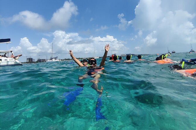 Top Isla Mujeres Catamaran Tour With Snorkel Open Bar and Buffet Lunch - Transportation and Pickup Details