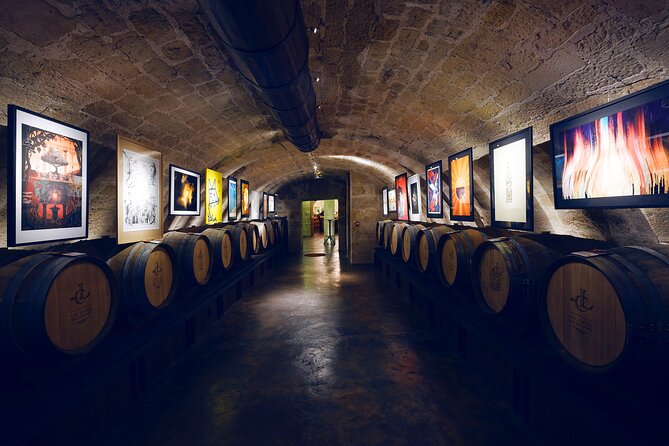 Audio Guided Tour and Wine Tasting at Caves Du Louvre - Tour Highlights