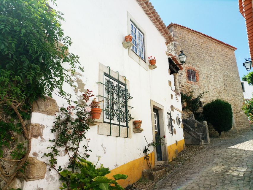 From Lisbon: Obidos and Tomar Day Trip With Transfer - Restrictions and Price