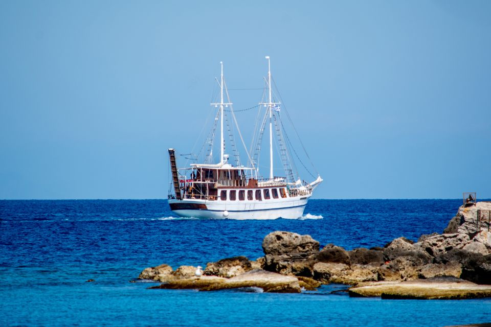 Rhodes: Boat Cruise With Food, Drinks, SUP, Kayak & Swimming - Bilingual Host Assistance Available