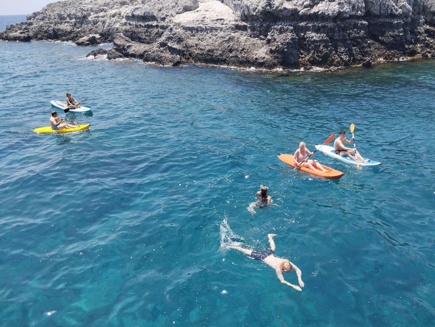 Rhodes: Boat Cruise With Food, Drinks, SUP, Kayak & Swimming - Adventure Activities Included