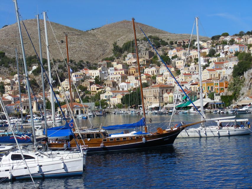 From Rhodes: Boat Trip to Symi Island With Hotel Transfer - Cancellation Policy and Guide Availability