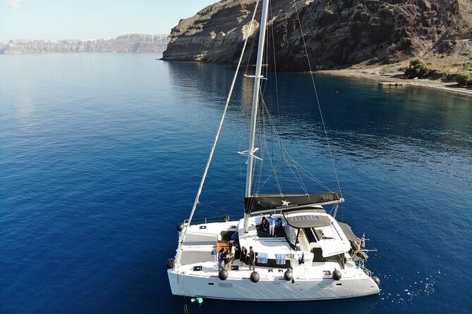 Half-Day Exclusive Catamaran Cruise in Santorini With Meal and Open Bar