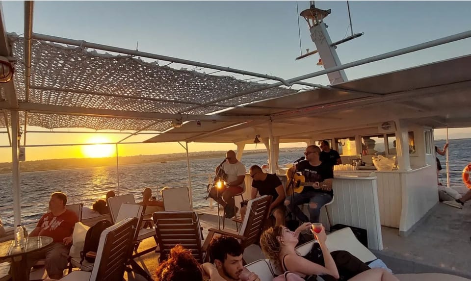 Rhodes: Sunset Cruise With Live Music, Greek Buffet Included - Key Points